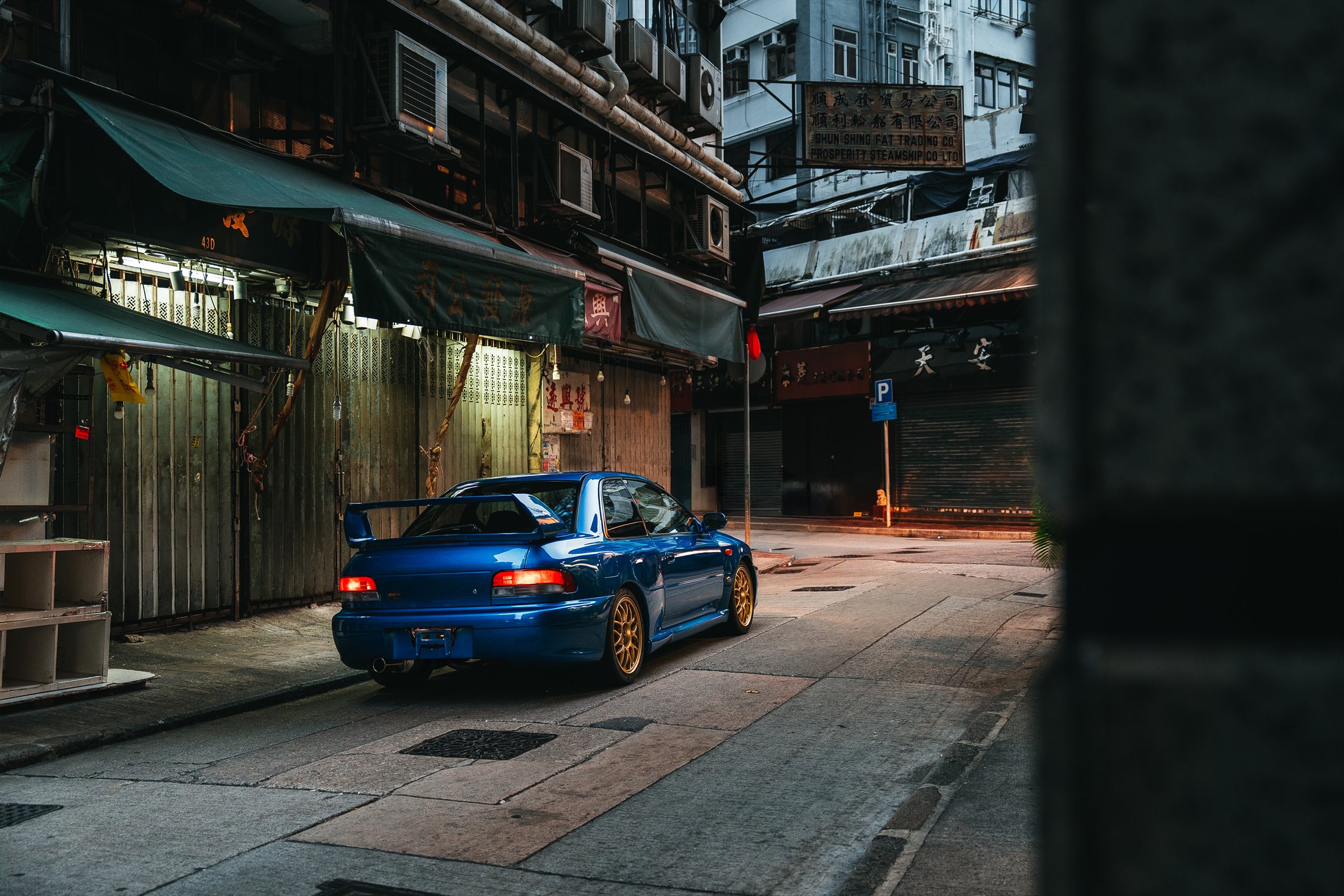 Subaru Impreza 22B STi disappearing into a Hong Kong lane