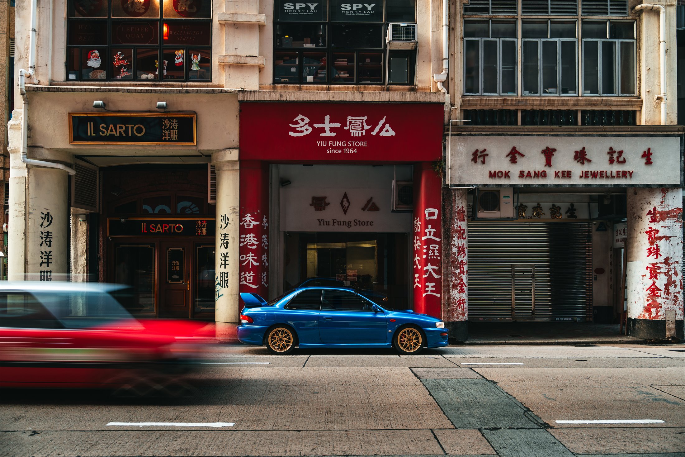 Subaru Impreza 22B STi in profile with passing city traffic