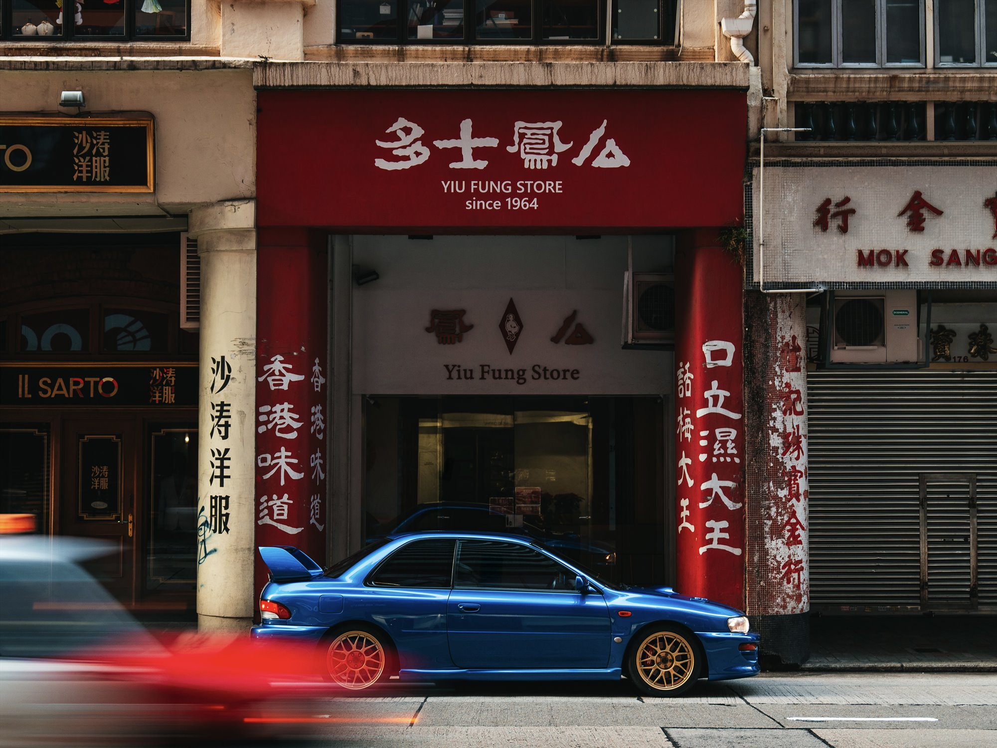 Subaru Impreza 22B STi in side profile on a Hong Kong street