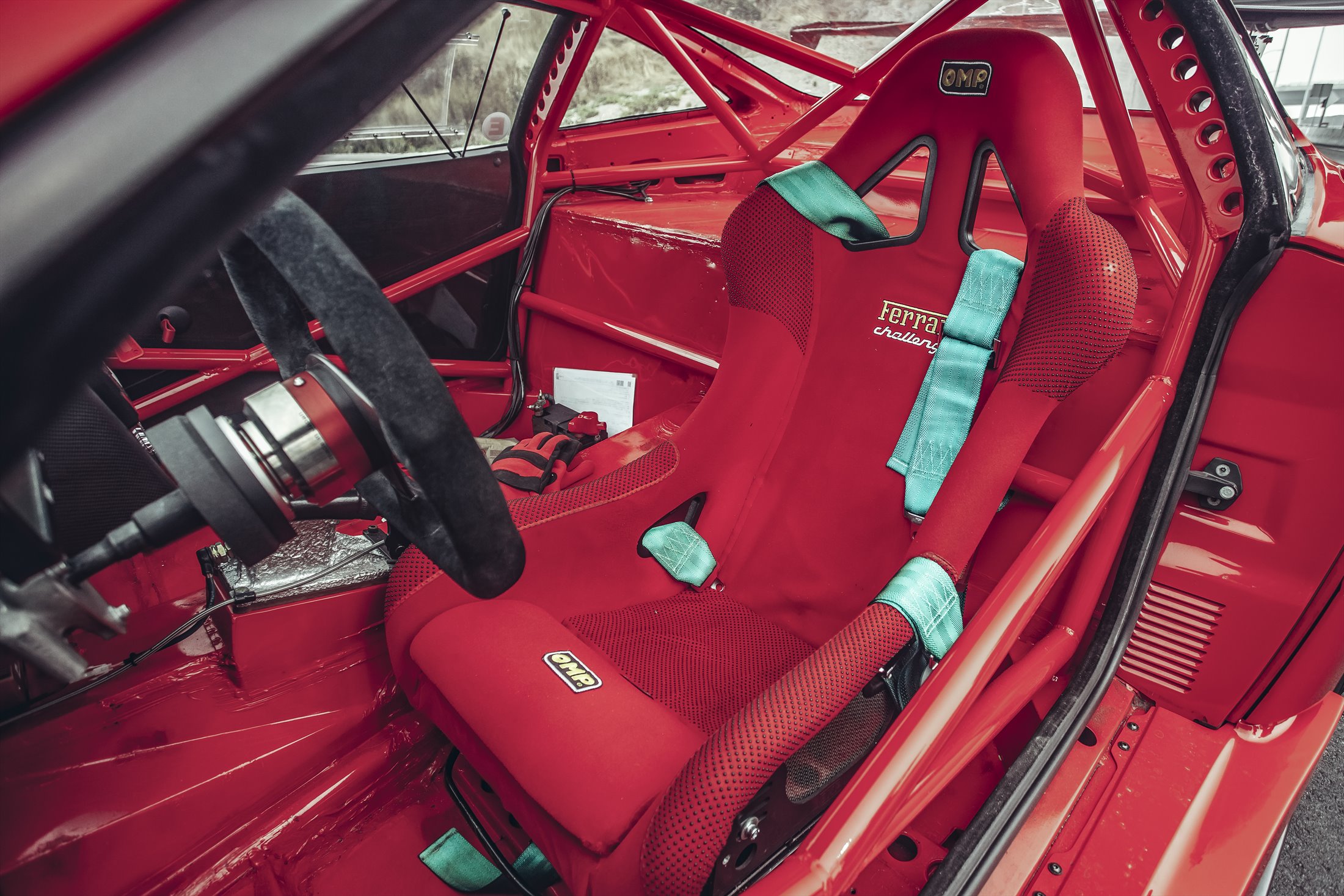 Ferrari racing seat, harness, and roll cage