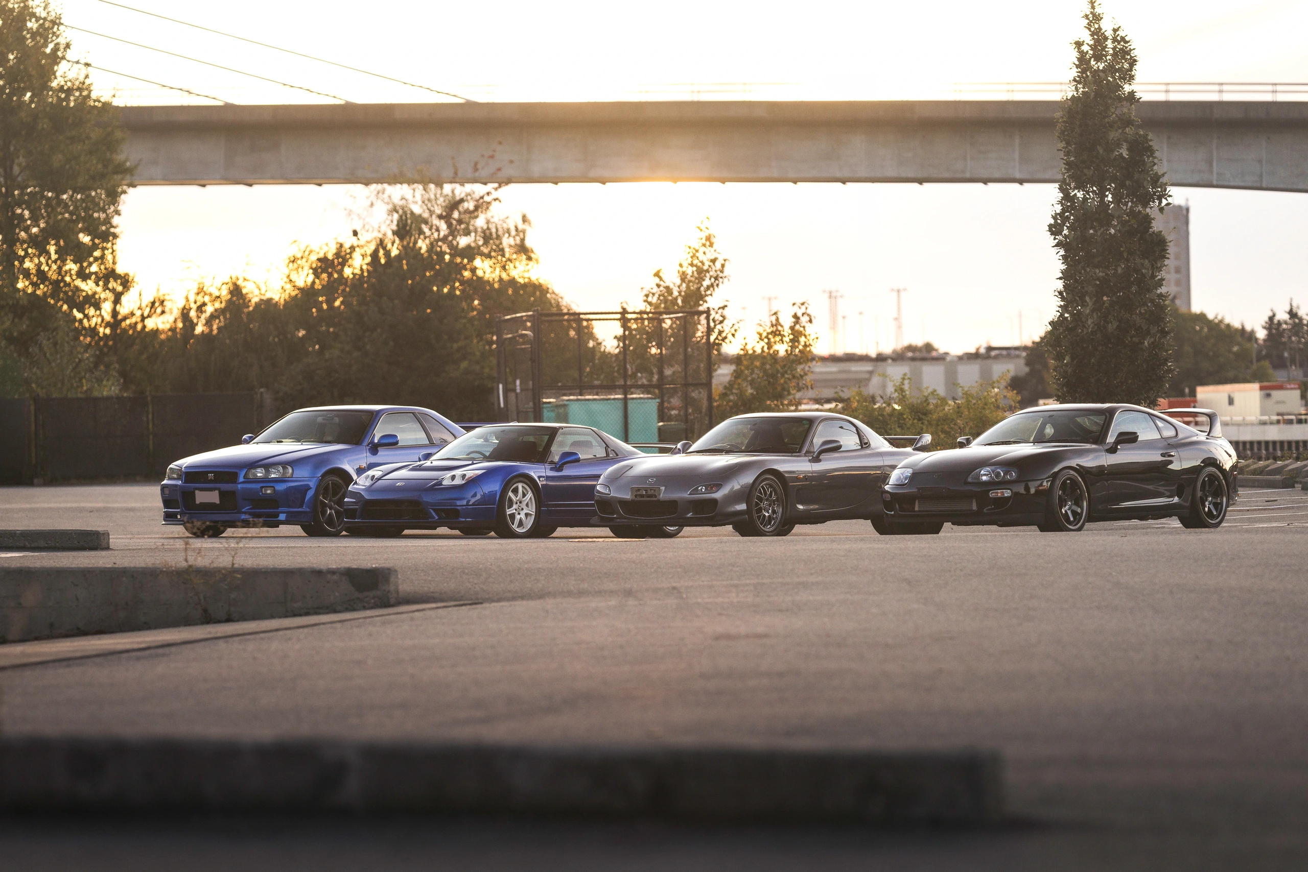 The four Japanese sports cars lined up in the last warm light of the day