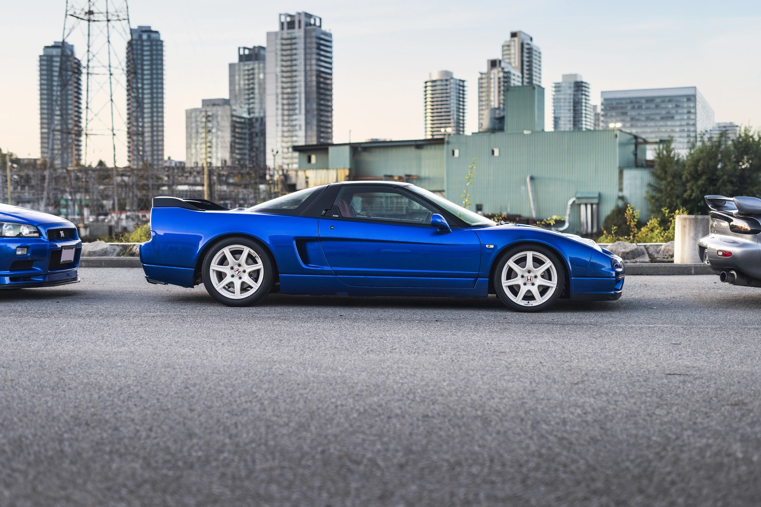 Long Beach Blue Pearl NSX-R in side profile, with its white wheels and low roofline